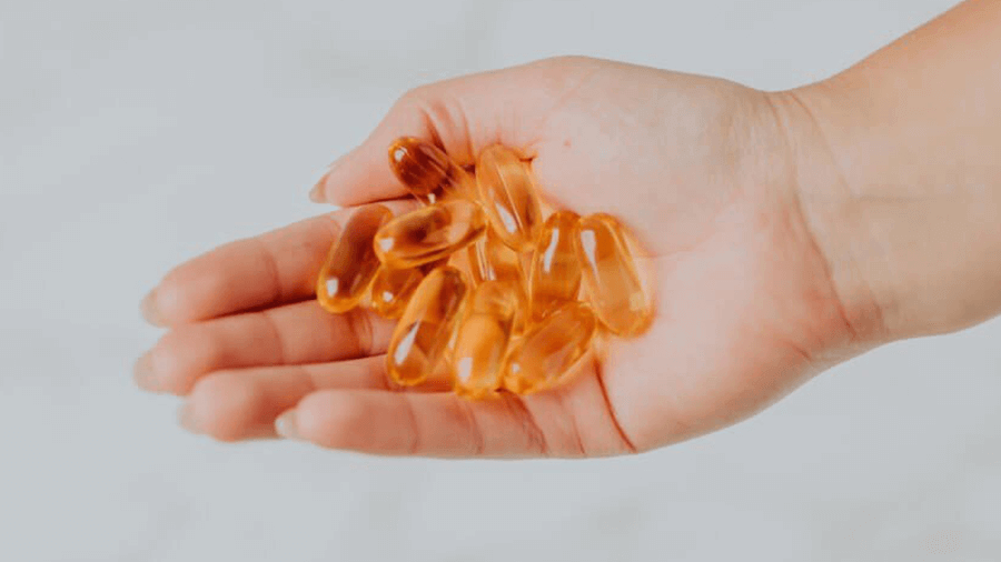 Medicines on a hand of Lady | Fascial Stretch Therapy | Wellness Co in Zeeland, MI