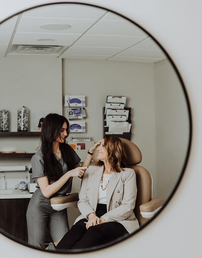 Esthetician nurse taling with patient | Wellness Co. | Zeeland, MI